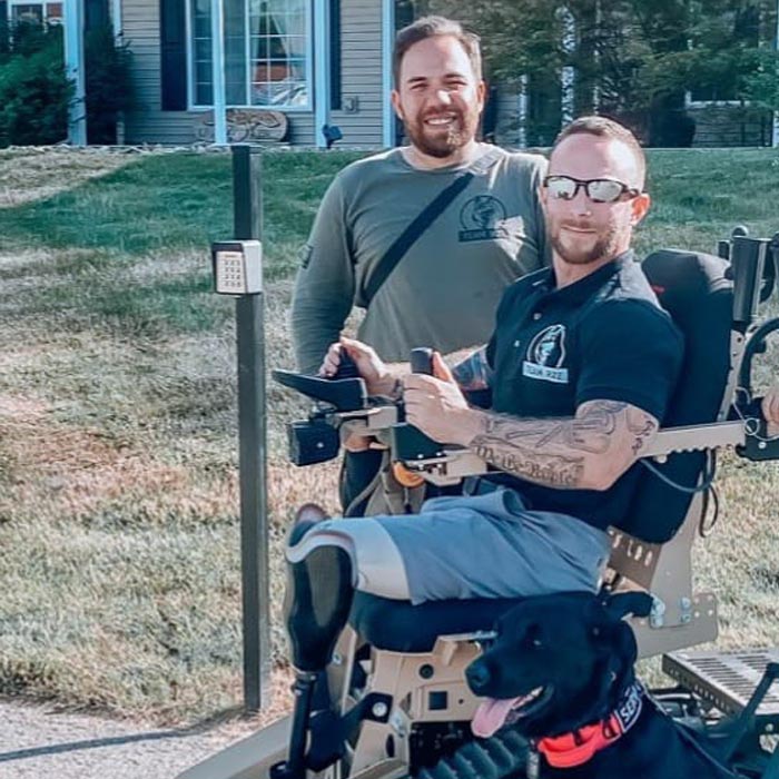 Two Veteran Heroes on outdoor walk with lifesaving service dog